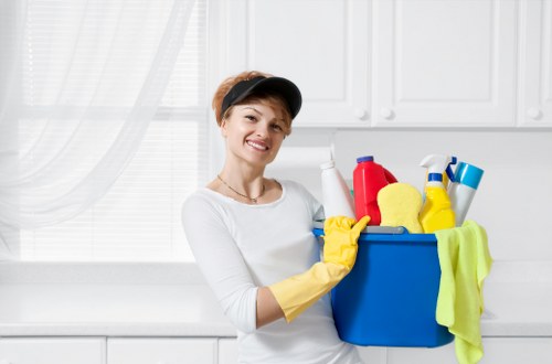 Cleaner identifying hazards and following safe work practices during a cleaning task