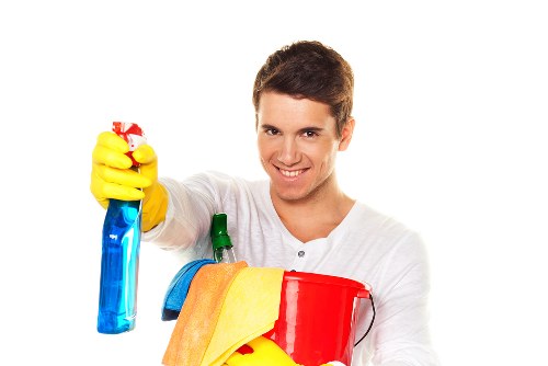 Technician performing oven cleaning in a Collierswood home